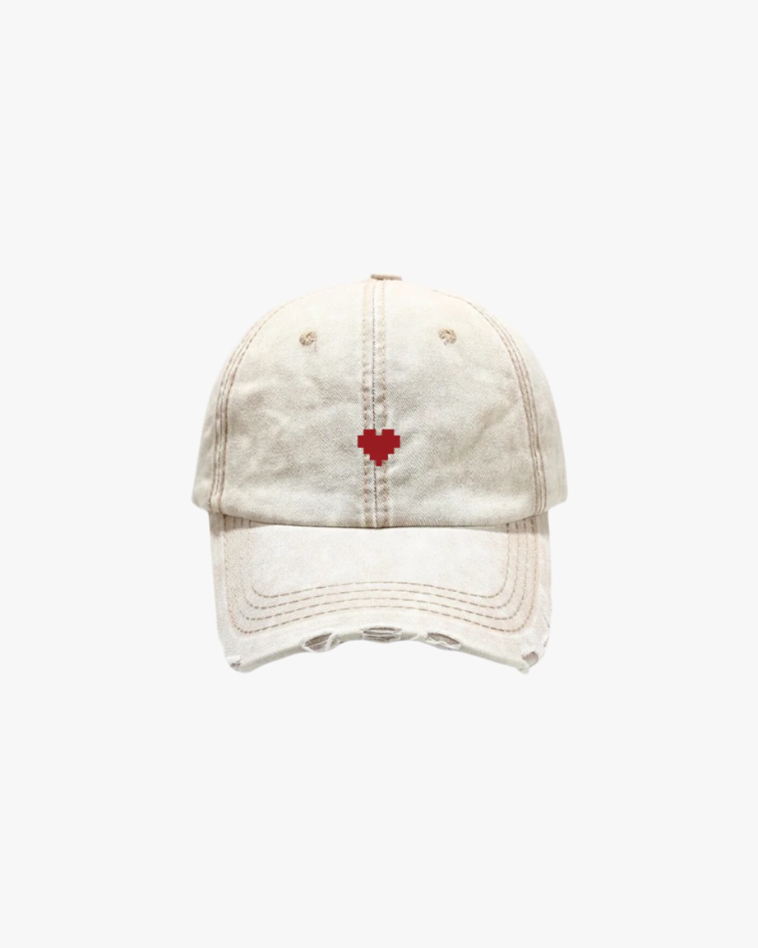 beige hat with red heart element